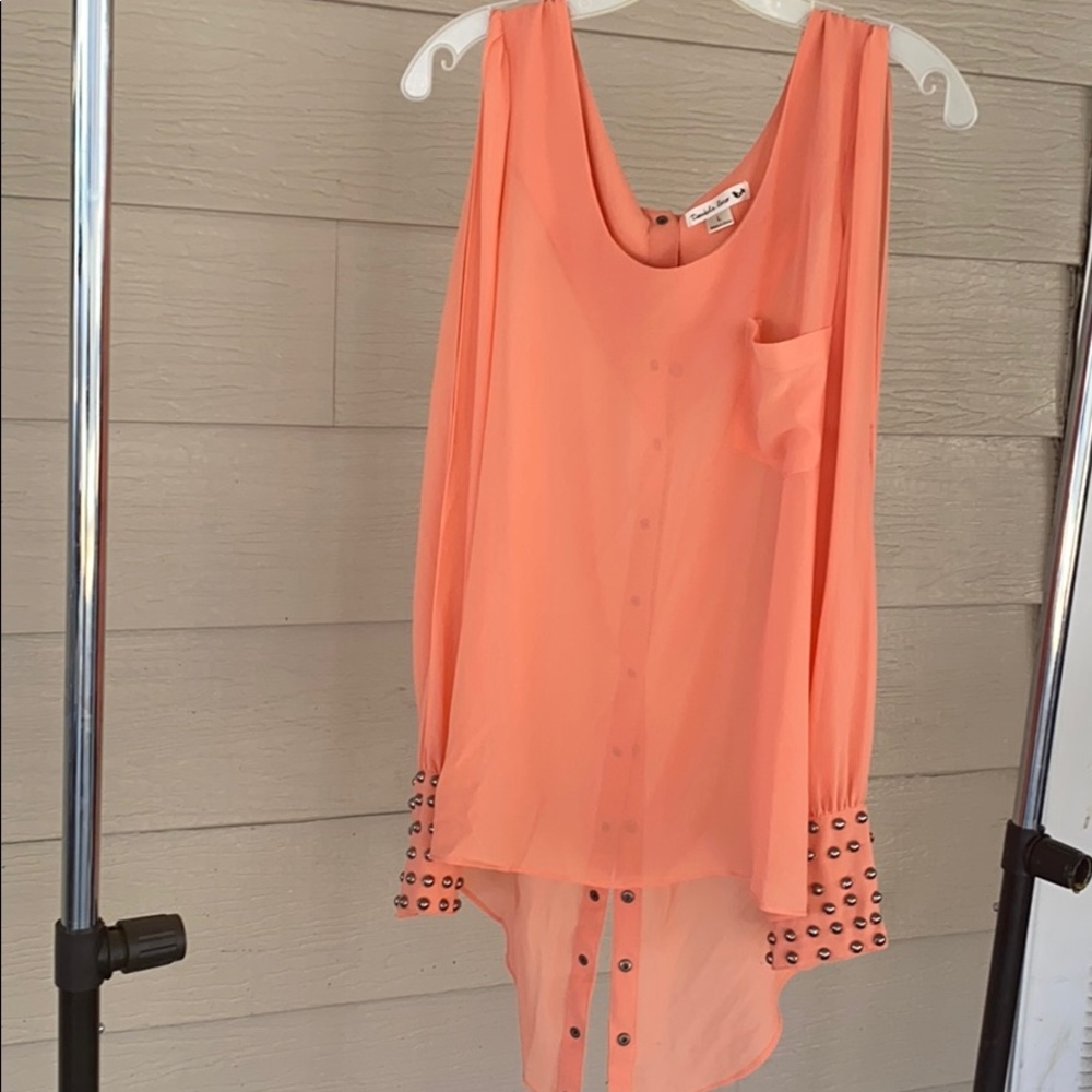 Coral long-sleeve blouse with studded cuffs